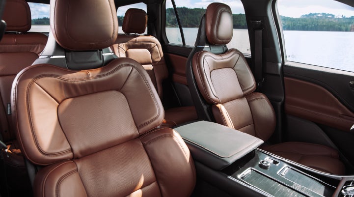 The front row's Perfect Position Seats in a 2024 Lincoln Aviator® Reserve model with Ebony Roast interior | Parks Lincoln of Tampa in Tampa FL