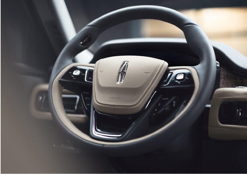 The intuitively placed controls of the steering wheel on a 2023 Lincoln Aviator® SUV | Parks Lincoln of Tampa in Tampa FL