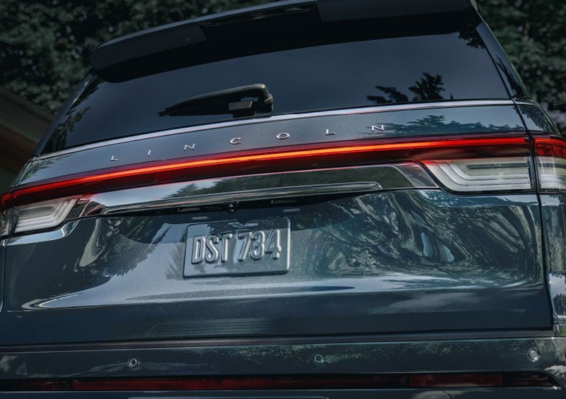 The wraparound rear lights of a Lincoln Navigator SUV are shown. | Parks Lincoln of Tampa in Tampa FL