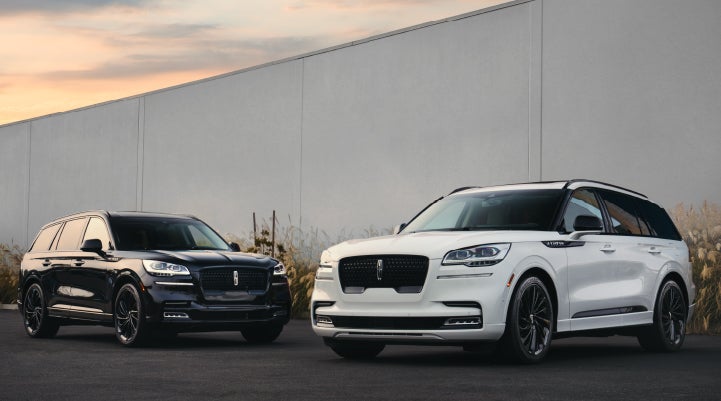 Two Lincoln Aviator® SUVs are shown with the available Jet Appearance Package | Parks Lincoln of Tampa in Tampa FL
