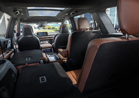 The interior of the 2025 Lincoln Aviator® SUV is shown with two seats folded down for added space. | Parks Lincoln of Tampa in Tampa FL