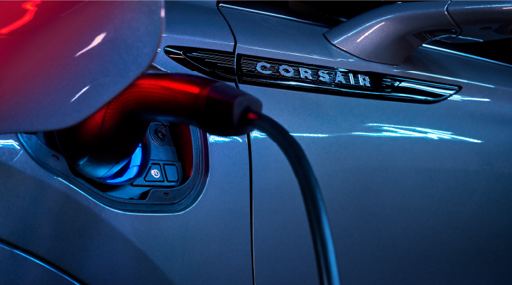 A charger plugged into the charging port of a 2025 Lincoln Corsair® Plug-in Hybrid model. | Parks Lincoln of Tampa in Tampa FL
