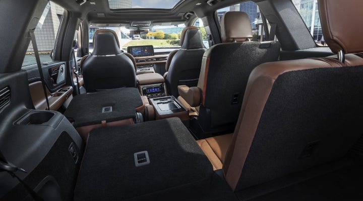 One side of the PowerFold® third-row seat and a second-row seat are folded forward in the 2026 Lincoln Aviator® SUV. | Parks Lincoln of Tampa in Tampa FL