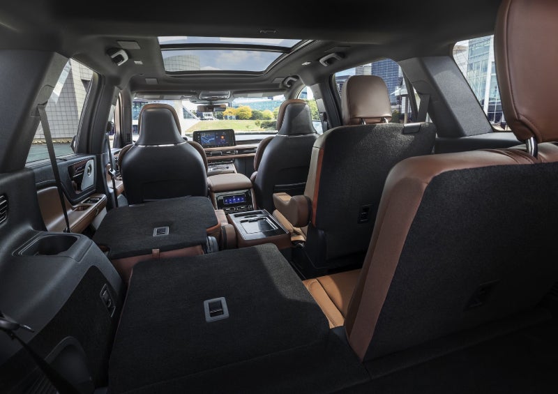 One side of the PowerFold® third-row seat and a second-row seat are folded forward in the 2026 Lincoln Aviator® SUV. | Parks Lincoln of Tampa in Tampa FL