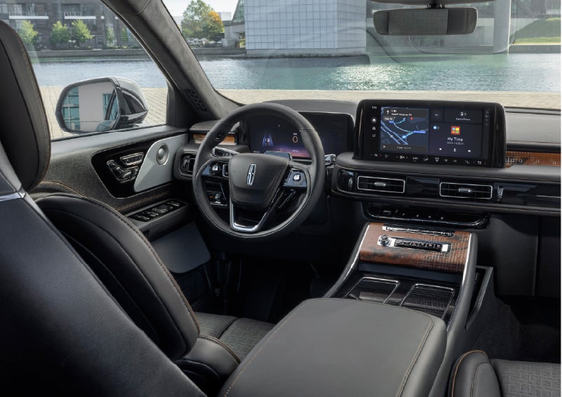 The interior of the 2026 Lincoln Aviator® SUV is shown parked with a view of a harbor through the windshield. | Parks Lincoln of Tampa in Tampa FL