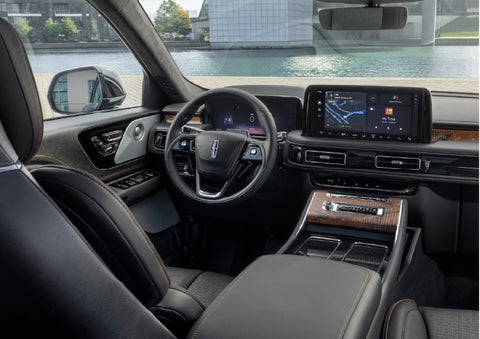 The interior of the 2026 Lincoln Aviator® SUV is shown parked with a view of a harbor through the windshield. | Parks Lincoln of Tampa in Tampa FL