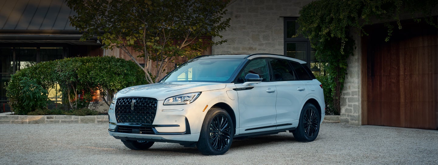 A 2026 Lincoln Corsair® SUV is parked in front off a luxury home. | Parks Lincoln of Tampa in Tampa FL