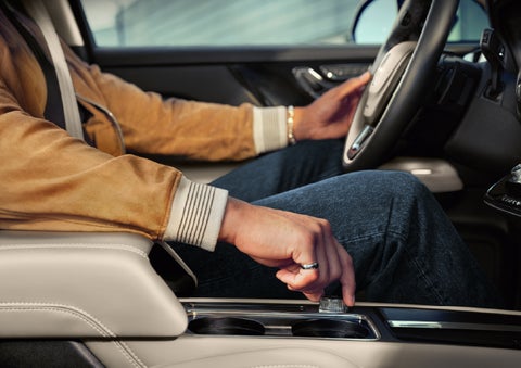 The driver of a 2026 Lincoln Corsair® SUV is shown selecting a drive mode. | Parks Lincoln of Tampa in Tampa FL