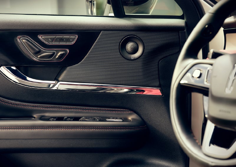 An audio speaker is shown in the driver's side door of a 2026 Lincoln Corsair® SUV | Parks Lincoln of Tampa in Tampa FL