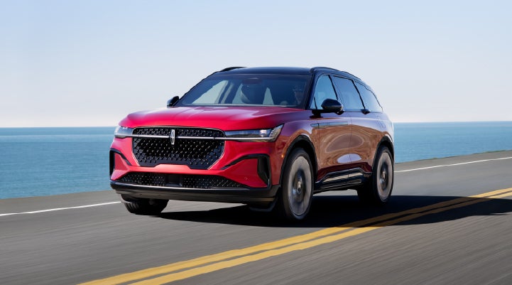 A 2026 Lincoln Nautilus® SUV is being driven on a seaside roadway. | Parks Lincoln of Tampa in Tampa FL