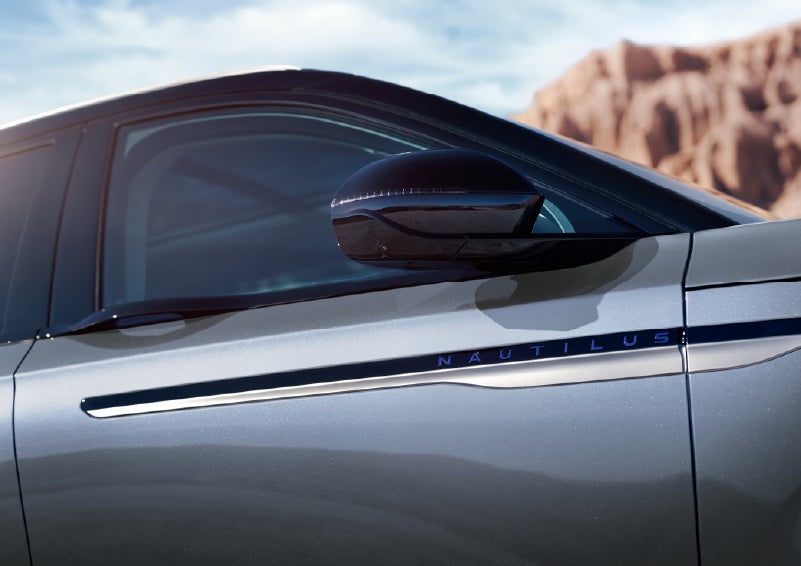 Blue lettering on the side of the vehicle that reads Nautilus indicates the available Hybrid Powertrain. | Parks Lincoln of Tampa in Tampa FL