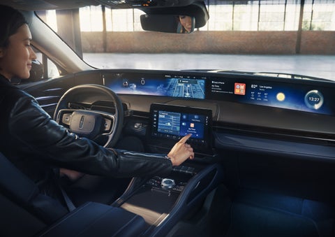 The driver of a 2026 Lincoln Nautilus® SUV interacts with the center touchscreen. | Parks Lincoln of Tampa in Tampa FL