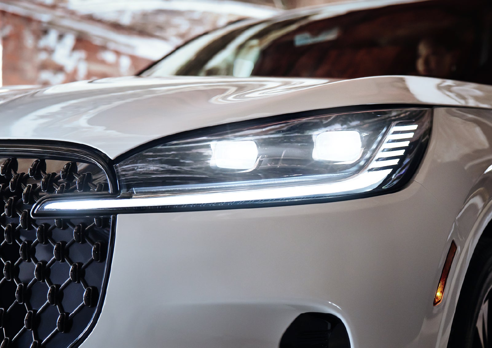 A close-up of a headlamp on the 2027 Lincoln Aviator® SUV is shown. | Parks Lincoln of Tampa in Tampa FL