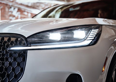 A close-up of a headlamp on the 2027 Lincoln Aviator® SUV is shown. | Parks Lincoln of Tampa in Tampa FL