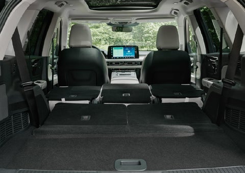 A rear to front view of the interior of a 2027 Lincoln Aviator® Black Label™ SUV shows the third and second rows folded flat | Parks Lincoln of Tampa in Tampa FL